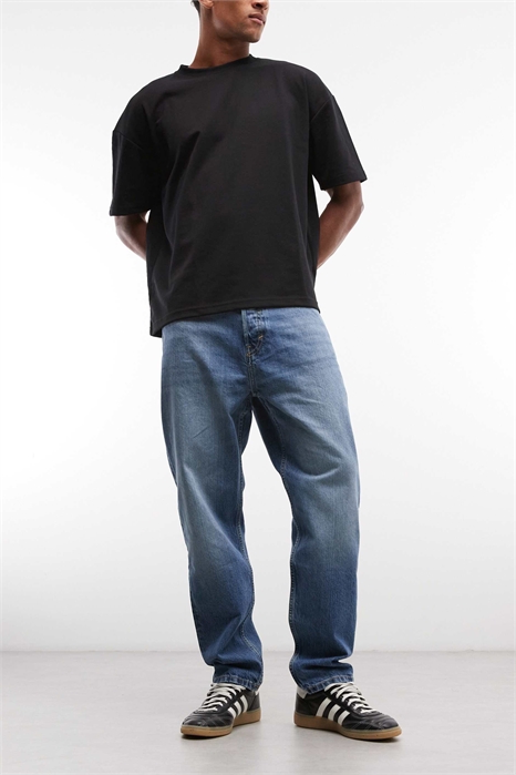 Джинсы свободного кроя с зауженными штанинами артикул 154837400