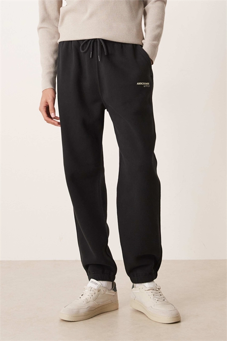 Джоггеры с логотипом и свободными манжетами артикул 155057892