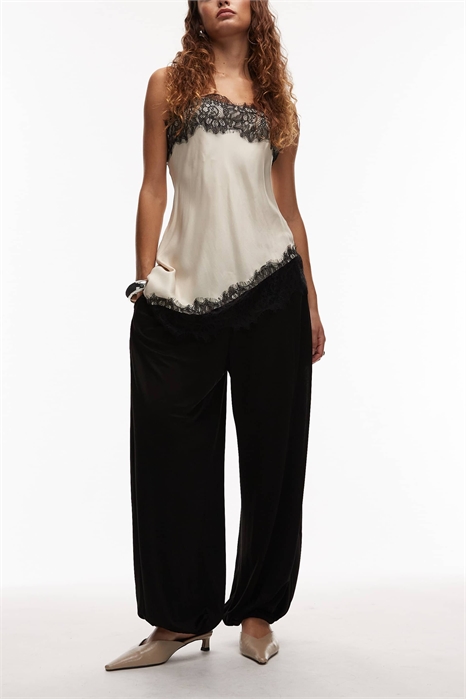 Брюки-балоны с блестящей отделкой, надеваемые через голову артикул 151901034