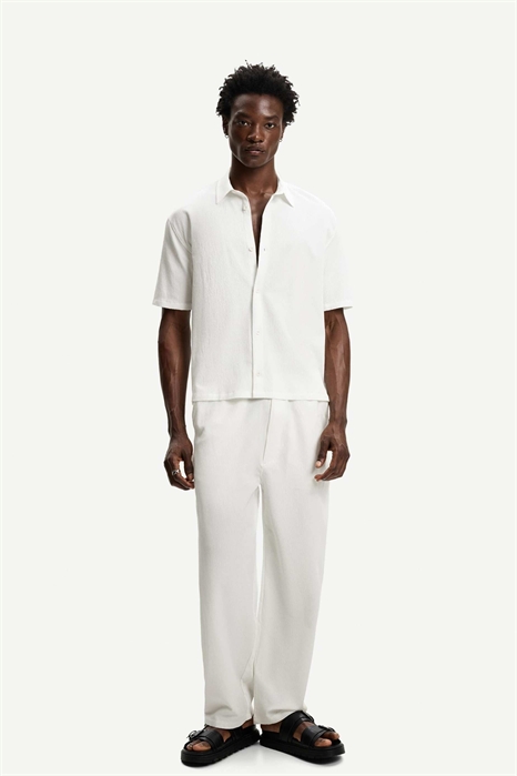 Брюки-джоггеры свободного кроя с плиссировкой артикул 149859724