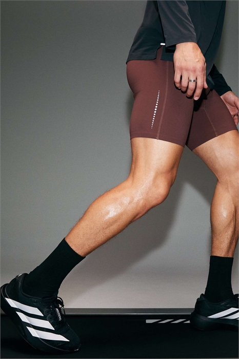 Высококачественные светоотражающие полуоблегающие беговые штаны с карманом для телефона и термопроклеенным подолом артикул 151964950