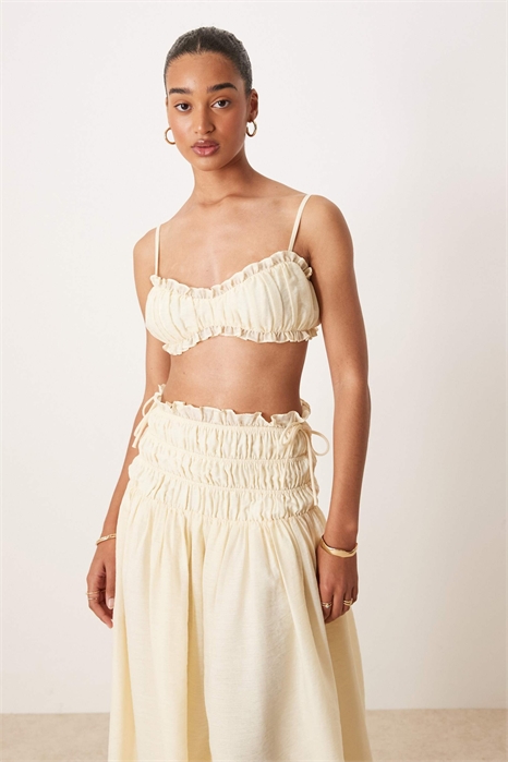Комплект из бежевого топа-бралетта с рюшами и завязками на спине и юбки из льняной ткани Soulie артикул 142845000