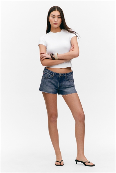 Мини-шорты из денима с низкой посадкой и необработанным подолом 1272330001