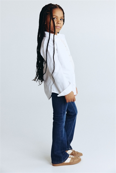 Джинсы с расклешенными штанинами из суперстрейча 1228540016