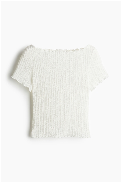 Приталенный топ с оверлочными деталями артикул 1273062001