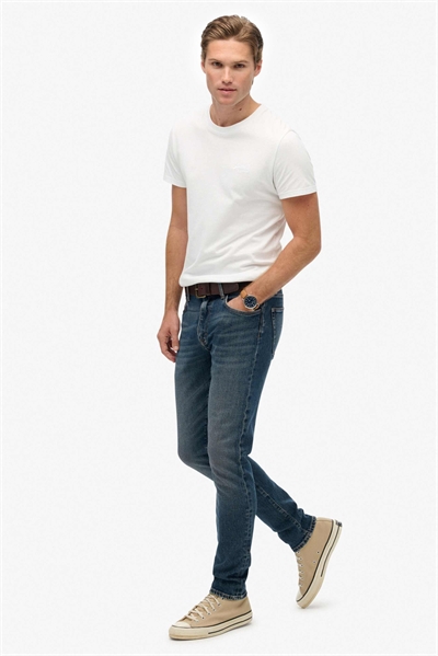 Хлопковые винтажные джинсы-слим синего цвета «шторм» артикул 153937686