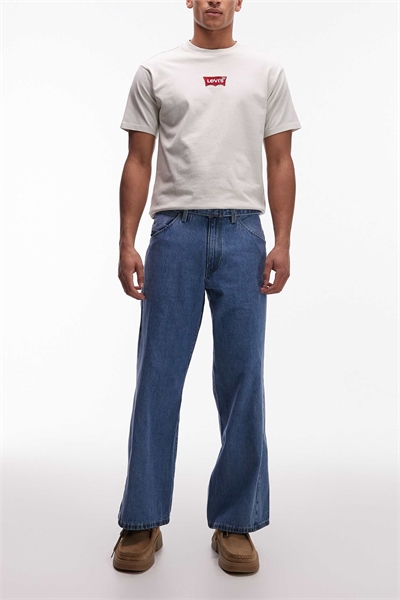 Джинсы свободного кроя с закрученными штанинами артикул 142116349