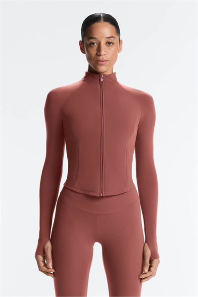 Легкая теплая куртка лилового цвета артикул 155526154