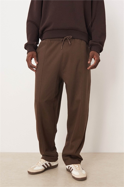 Широкие джоггеры с декоративными складками артикул 148917514