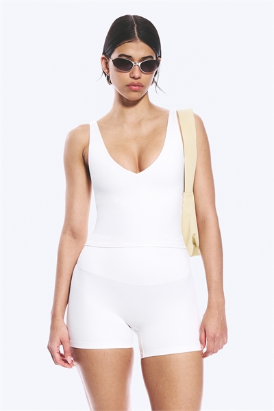 Укороченный спортивный топ с глубоким вырезом артикул 1333497002
