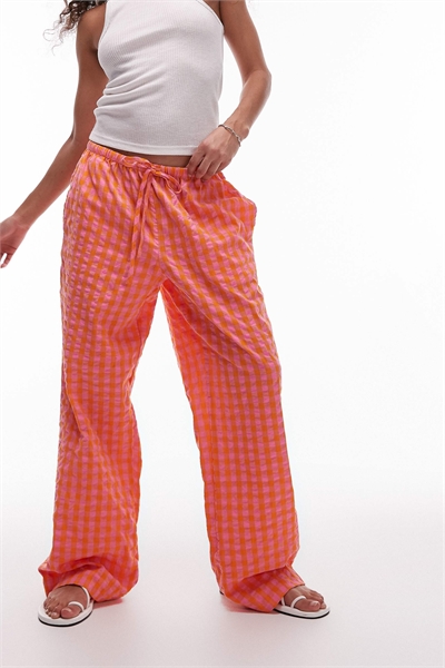 Брюки в оранжевую клетку артикул 142428497