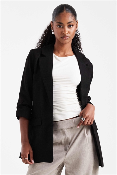 Блейзер с рукавами с рюшами черного цвета артикул 148518875