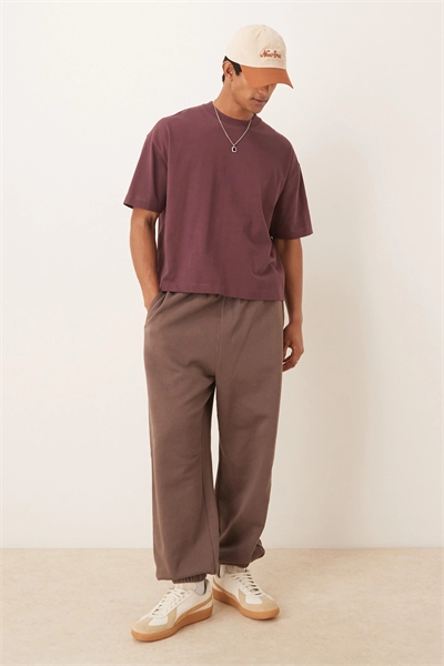 Штаны-треники с очень широкими штанинами и отворотами артикул 148939958