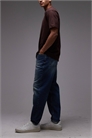 Джинсы свободного кроя с зауженными штанинами артикул 152238592