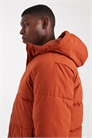 Пуховик с капюшоном оранжевого цвета артикул 148852603