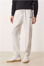 Джоггеры с логотипом и свободными манжетами артикул 155057897