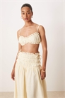 Комплект из бежевого топа-бралетта с рюшами и завязками на спине и юбки из льняной ткани Soulie артикул 142845000